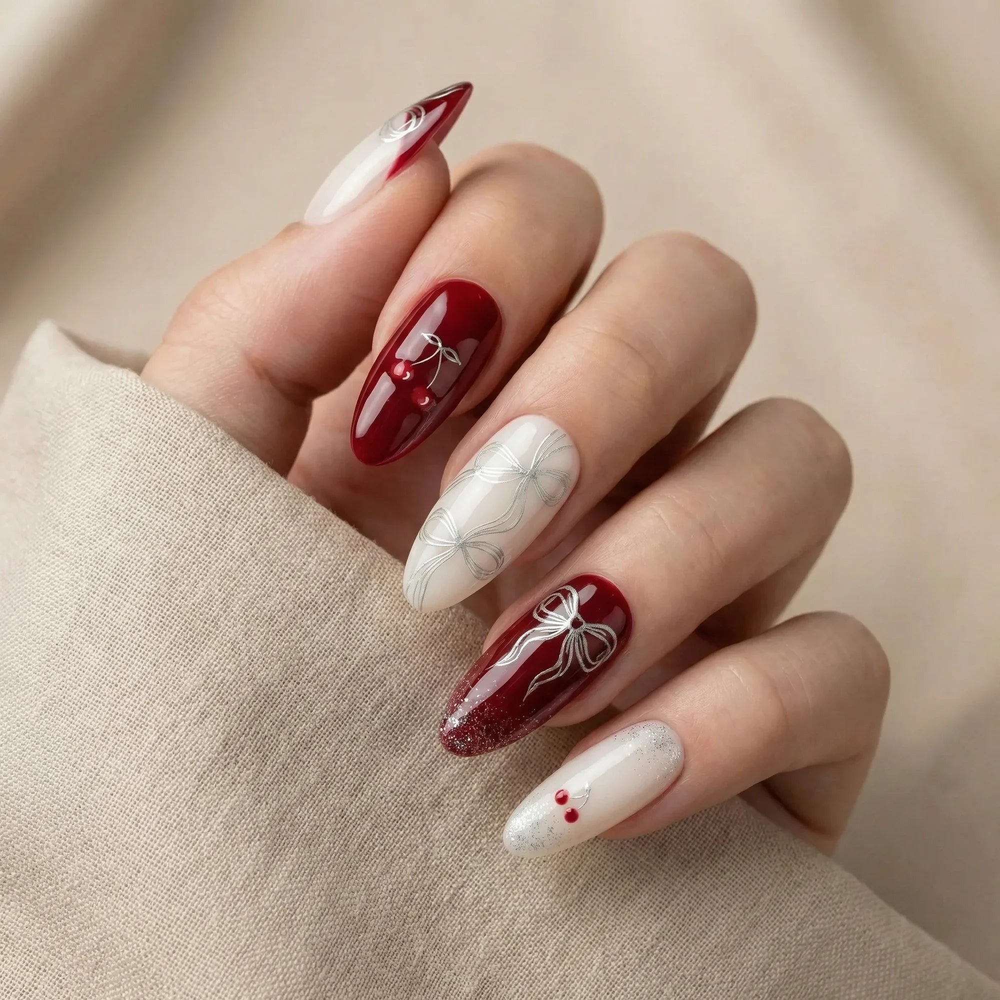 cherry red glitter french tip almond medium press on nails cherry bow mockup 01, burgundy french tip almond press on nails tortoise shell red gemstone mockup 01, red green ivory glitter french tip christmas square short press on nails holly mockup 01
