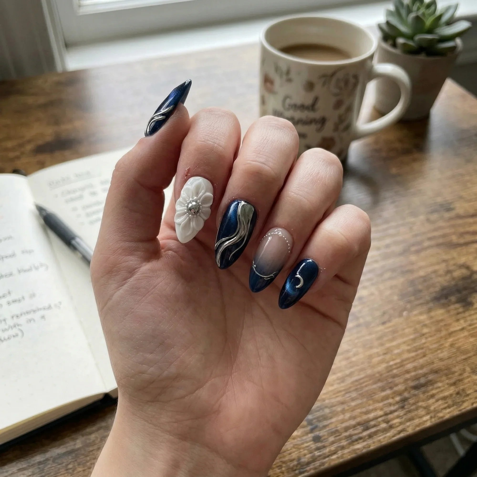 navy blue cat eye 3d stiletto medium press on nails clear flower lifestyle 02, navy nude silver hand painted ombre square press on nails gold moon star lifestyle 02, white navy hand painted stiletto medium press on nails moon star constellation lifestyle 02, navy blue french tip almond press on nails cat eye silver chrome mockup 01, red white blue 3d cat eye 4th of july almond press on nails star glitter stripe mockup 01