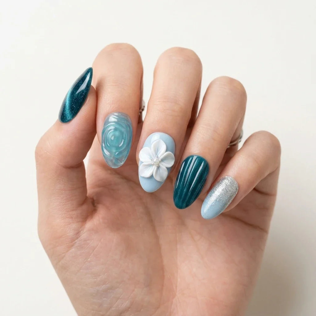 teal sky blue 3d cat eye almond press on nails flower pearl glitter lifestyle 02, blue pink cat eye almond medium press on nails celestial mockup 01, black bronze blue cat eye hand painted almond press on nails floral gold flake flat lay 03, burgundy teal cat eye almond long press on nails gold filigree mockup 01