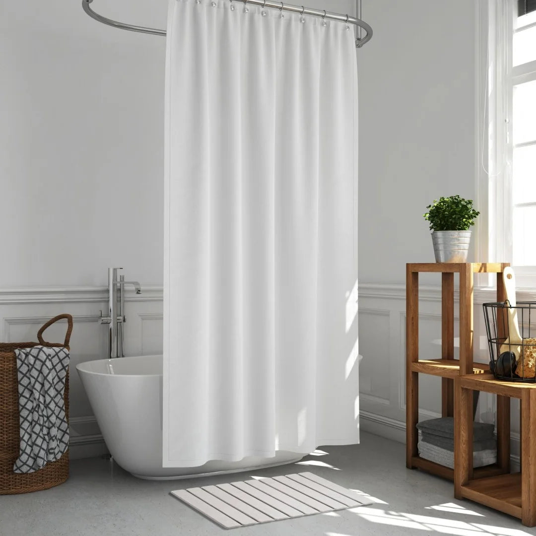 Bathroom with a white shower curtain, freestanding bathtub, and wooden shelf.