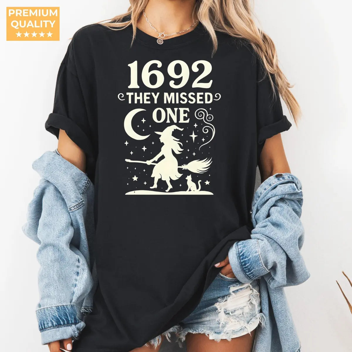 Comfort Colors T-shirt in Black color featuring 1692 They Missed One flying witch graphic