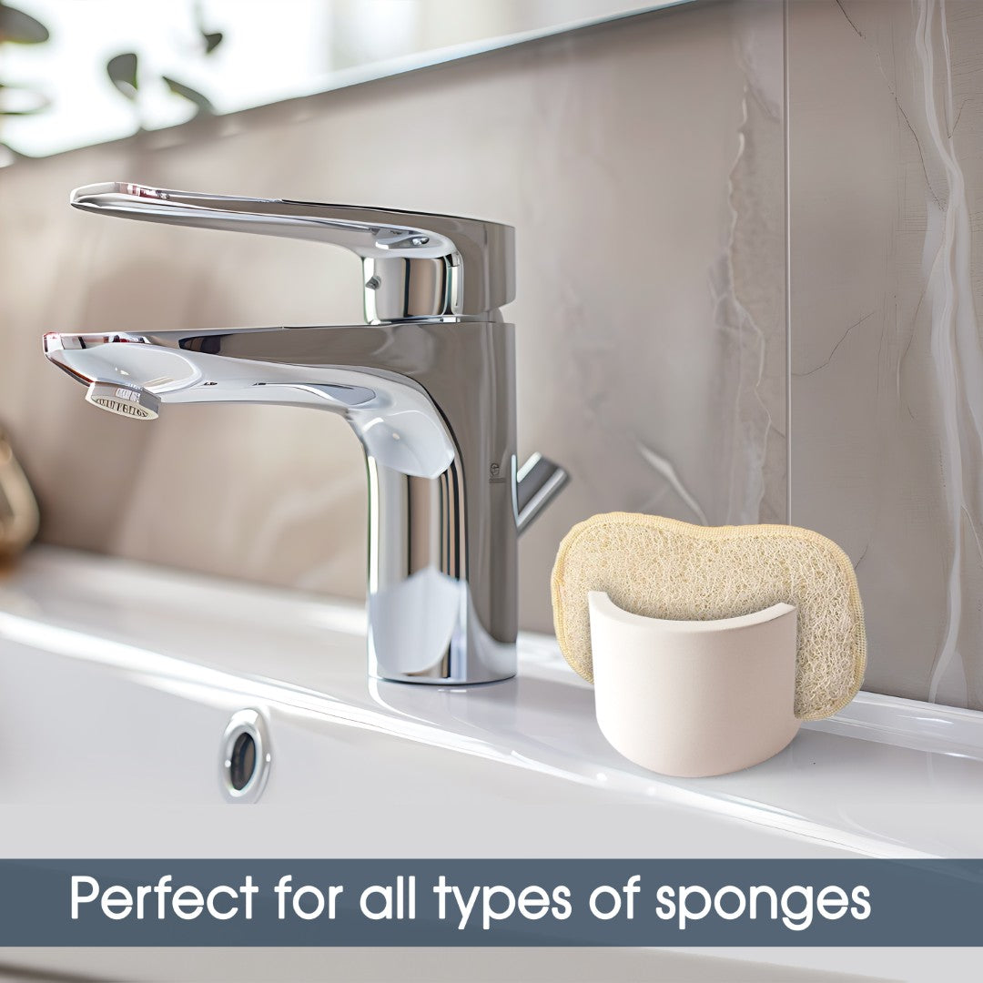 Sponge holder with sponge on a sink next to a faucet