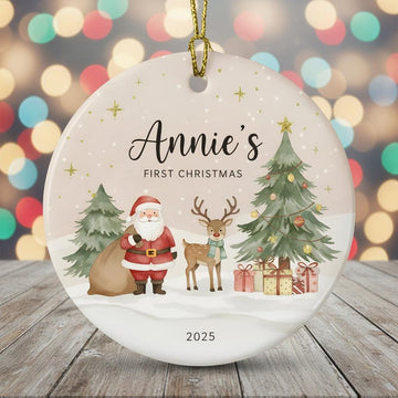 Christmas ornament with Santa, reindeer, and Christmas trees on a wooden surface with blurred lights in the background.