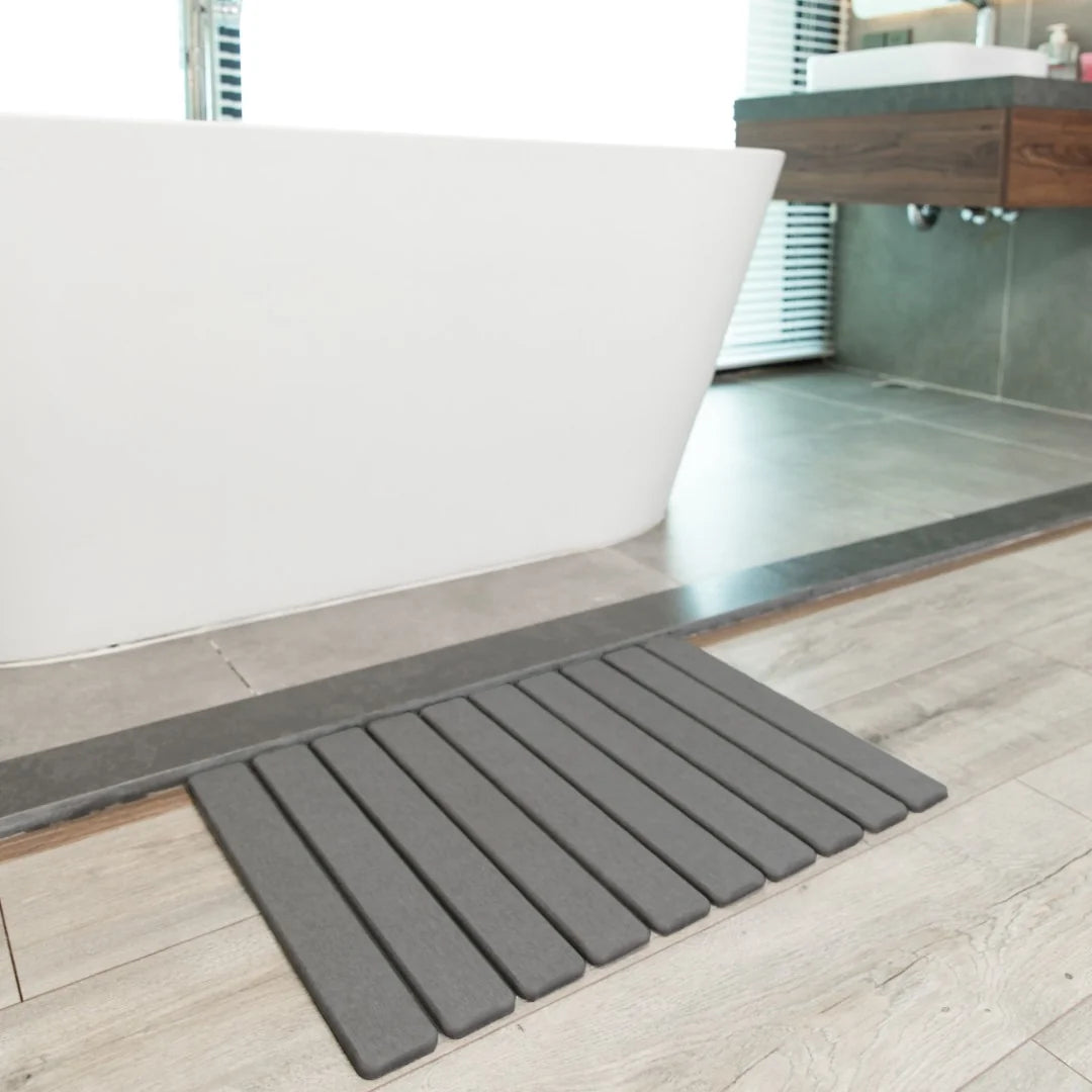 c817b350-3a69-4e71-ae89-f035597eac6a/Dark_Gray_Stone_Bath_Mat_c5307917-a64e-42a4-9ac9-93b8f9191140.webp