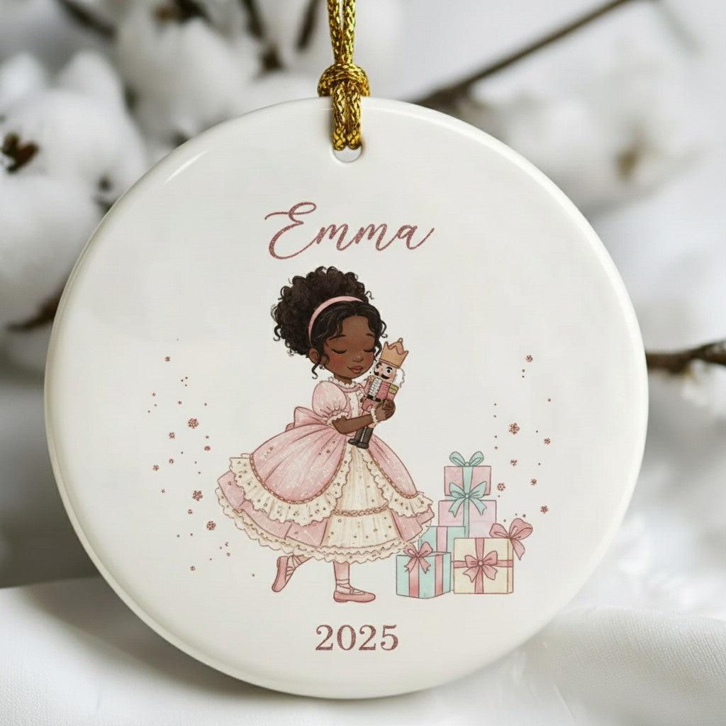 Decorative ornament with a girl holding gifts and the name 'Emma' on a white background.