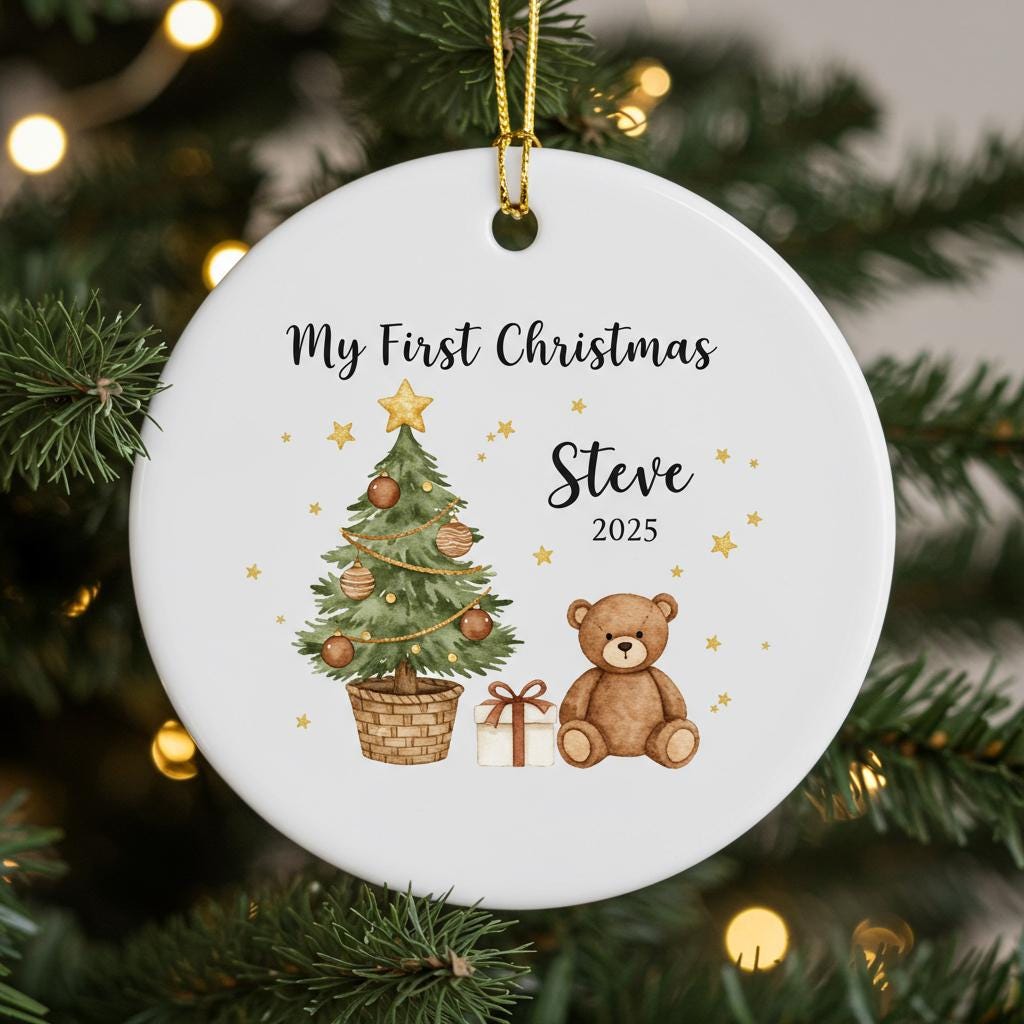 Round Christmas ornament with tree, teddy bear, and gift on a white background, hanging on a decorated tree.