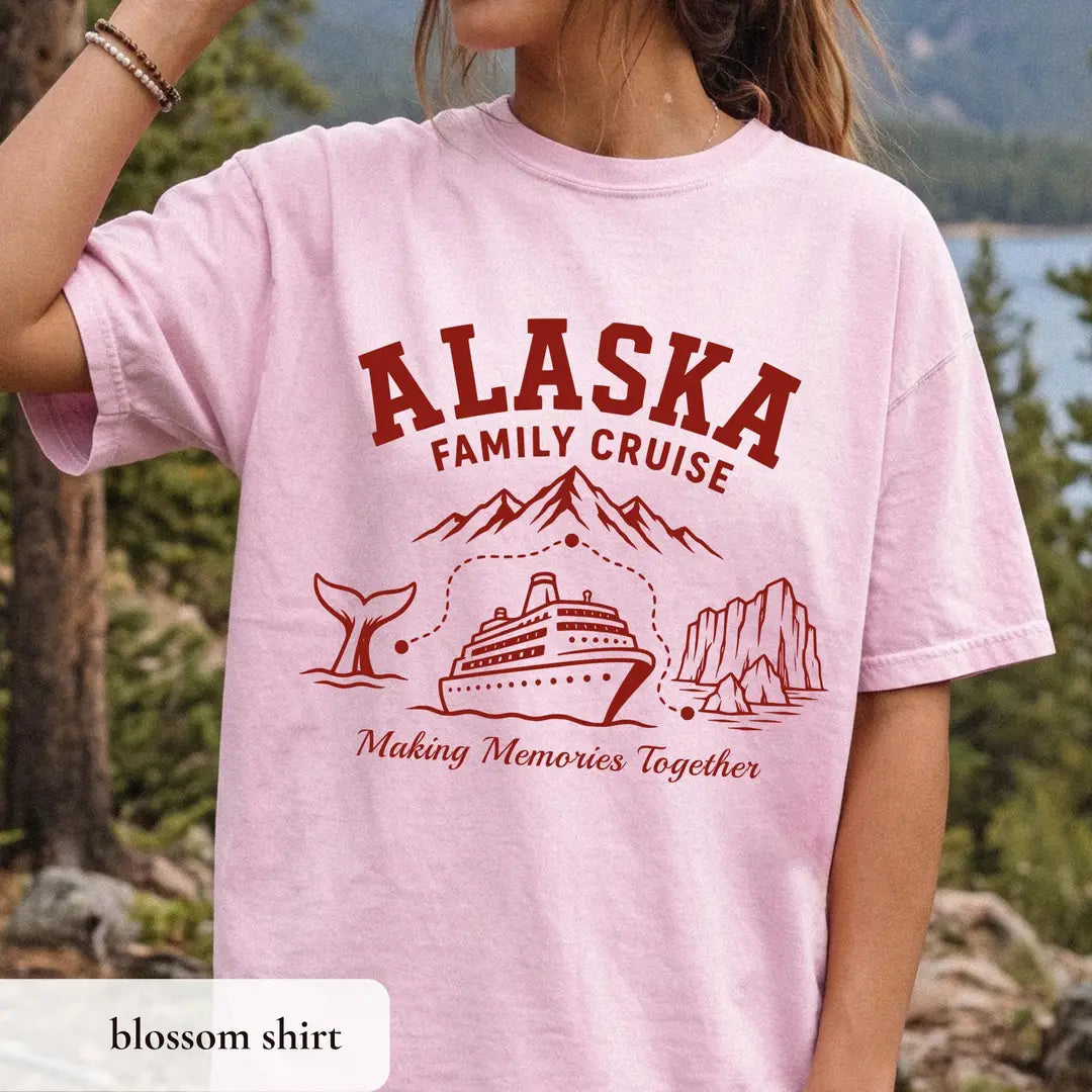 Woman in a Blossom pink Comfort Colors tee by a mountain lake, crimson Alaska Family Cruise over a ship and Making Memories