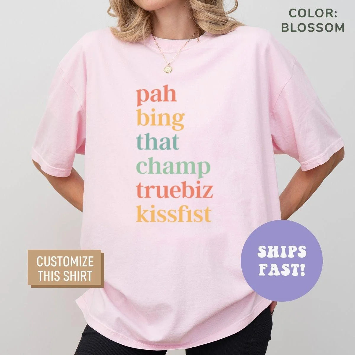 Woman in a Blossom pink Comfort Colors tee with six stacked ASL slang words in coral, gold and green serif