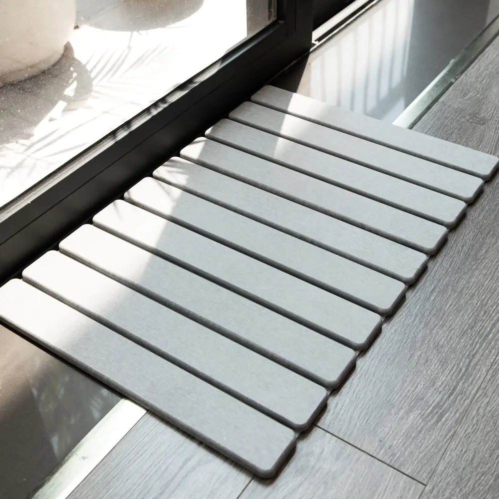 a6588150-746f-4b5a-a17e-e5f660c8b77c/bathroom-mat-absorbent-grey-slat-design.webp