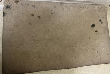 Dirty metal surface with rust and debris