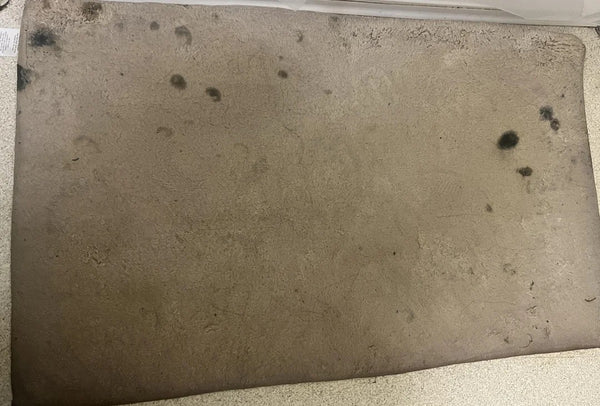 Dirty metal surface with rust and debris