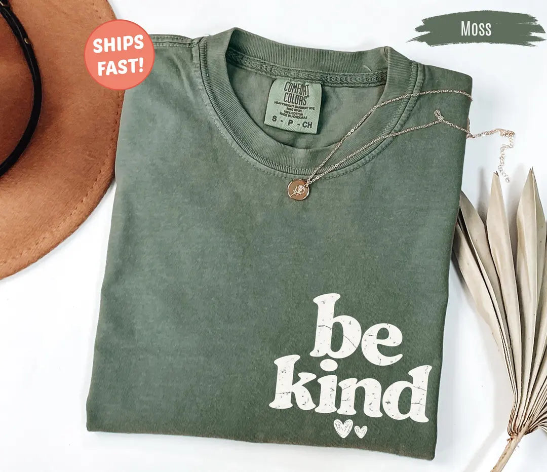 Be Kind graphic Comfort Colors T-shirt in Moss, main product photograph.