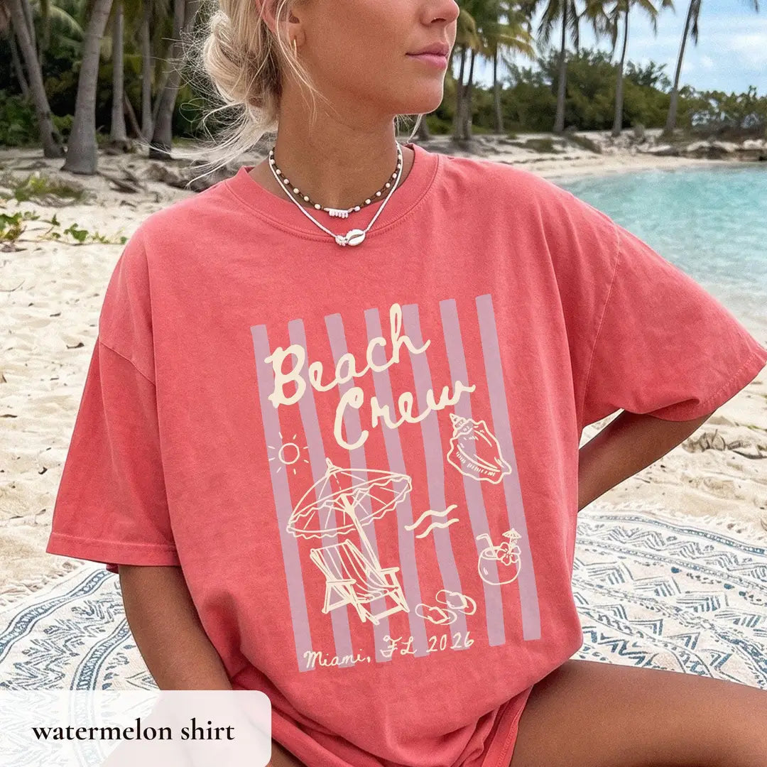 Woman in a Watermelon Comfort Colors tee by turquoise water, ivory beach crew script, umbrella and lounge chair