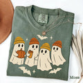 Comfort Colors T-shirt in Moss color featuring ghosts in beanies holding pumpkin and coffee graphic