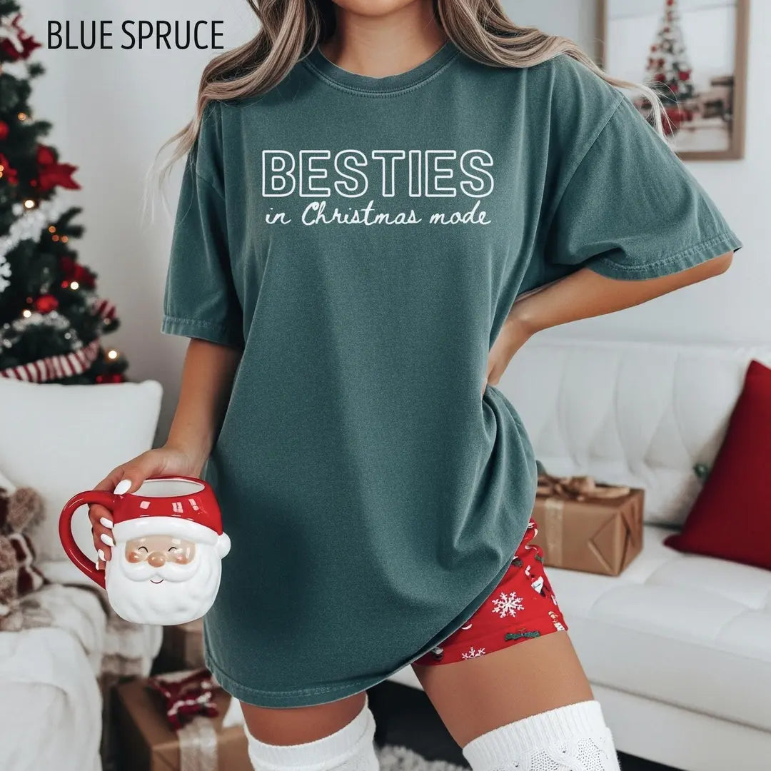 Besties in Christmas Mode Comfort Colors 1717 T-shirt modeled in Blue Spruce.