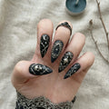 black hand painted halloween stiletto medium press on nails gothic skull mockup 01