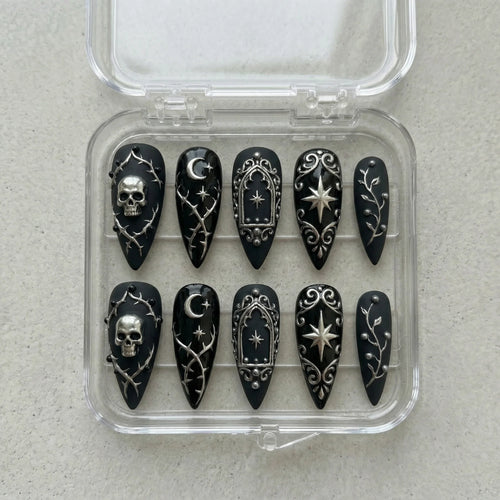 black hand painted halloween stiletto medium press on nails flat lay 01