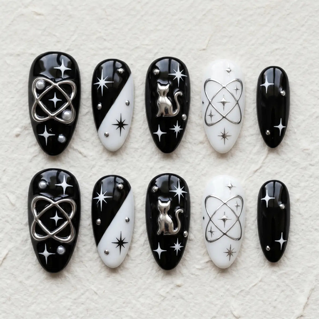 black white 3d almond press on nails goth silver cat planet star flat lay 01