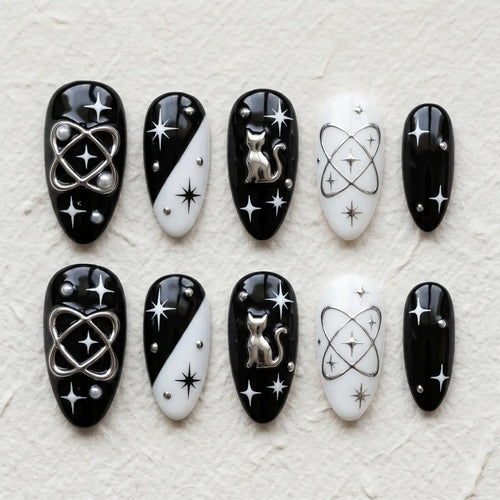 black white 3d almond press on nails goth silver cat planet star flat lay 01