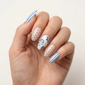 blue nude hand painted almond press on nails floral stripe polka dot flat lay 03