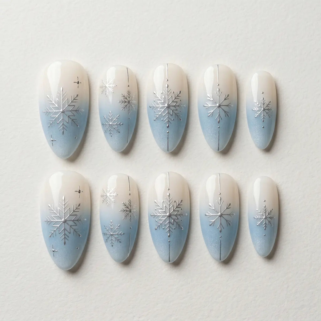 blue white ombre almond press on nails silver snowflake flat lay 04