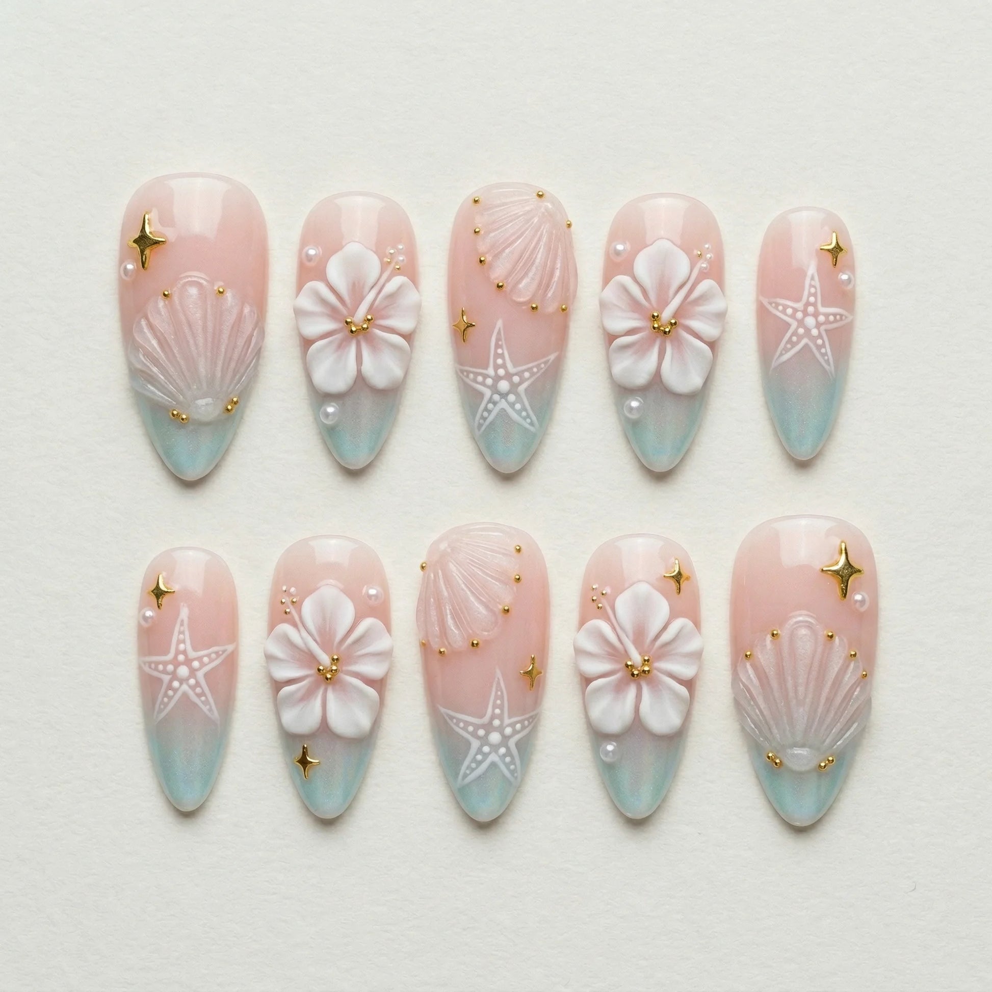 blush pink 3d almond medium press on nails hibiscus clear seashell flat lay 01