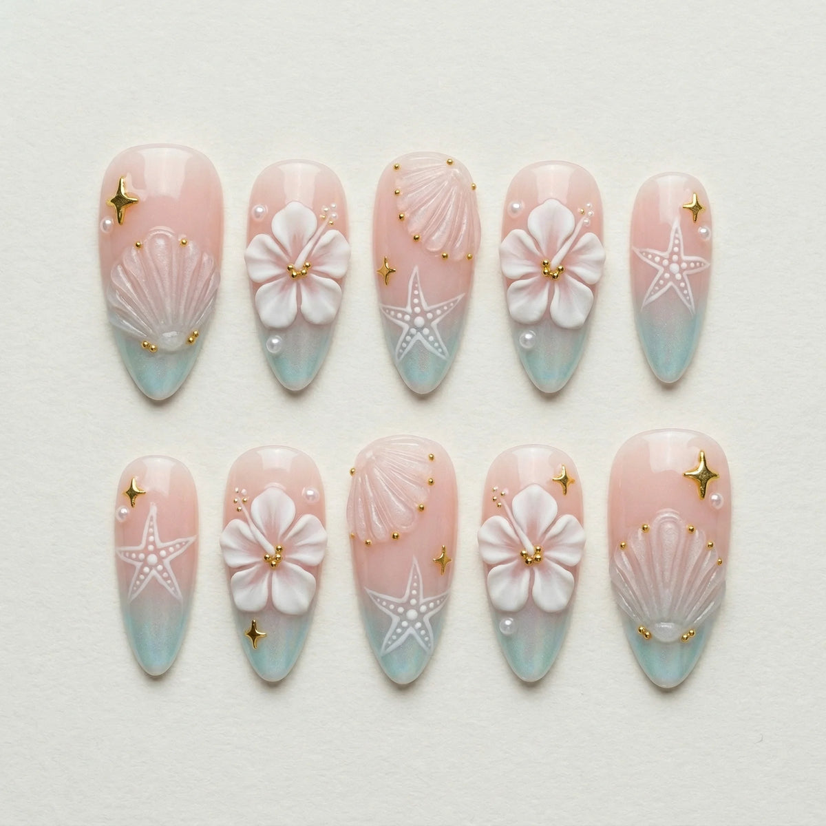 blush pink 3d almond medium press on nails hibiscus clear seashell flat lay 01