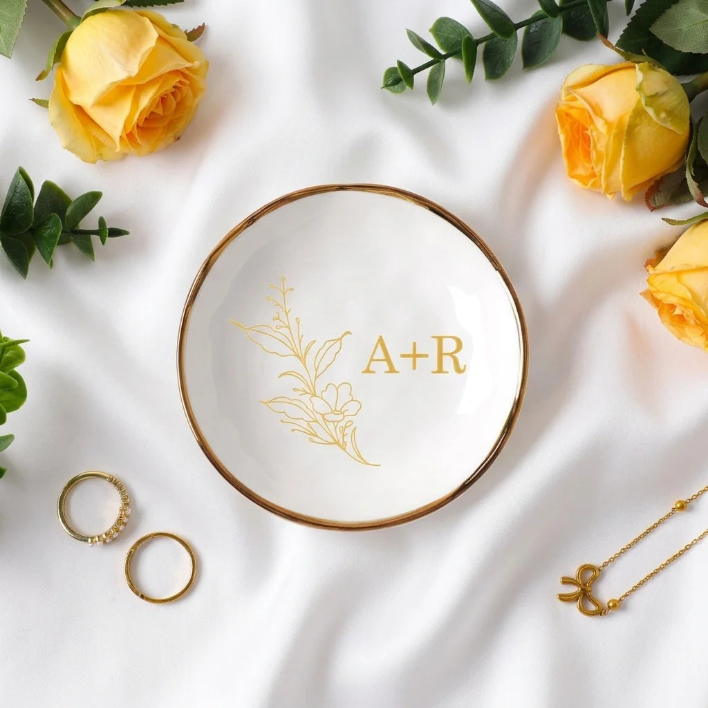 Two gold foil botanical branch personalized engagement ring dishes with couple initials
