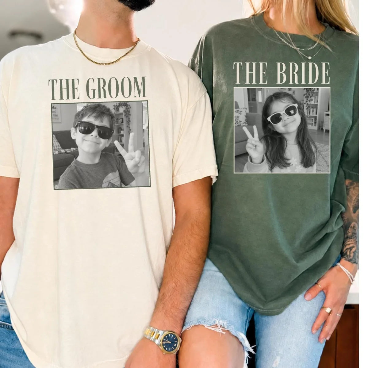 Couple in Ivory and Moss green Comfort Colors tees reading the groom and the bride over framed black and white photos