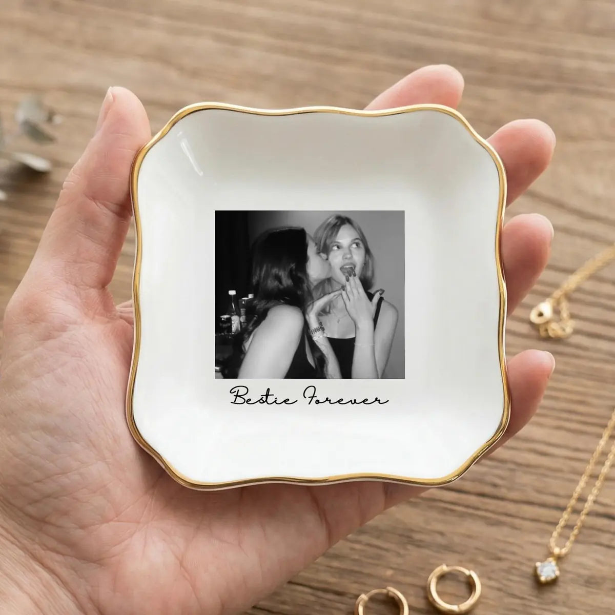 Close-up detail of glossy ceramic finish and gold rim on personalized bridesmaid trinket tray