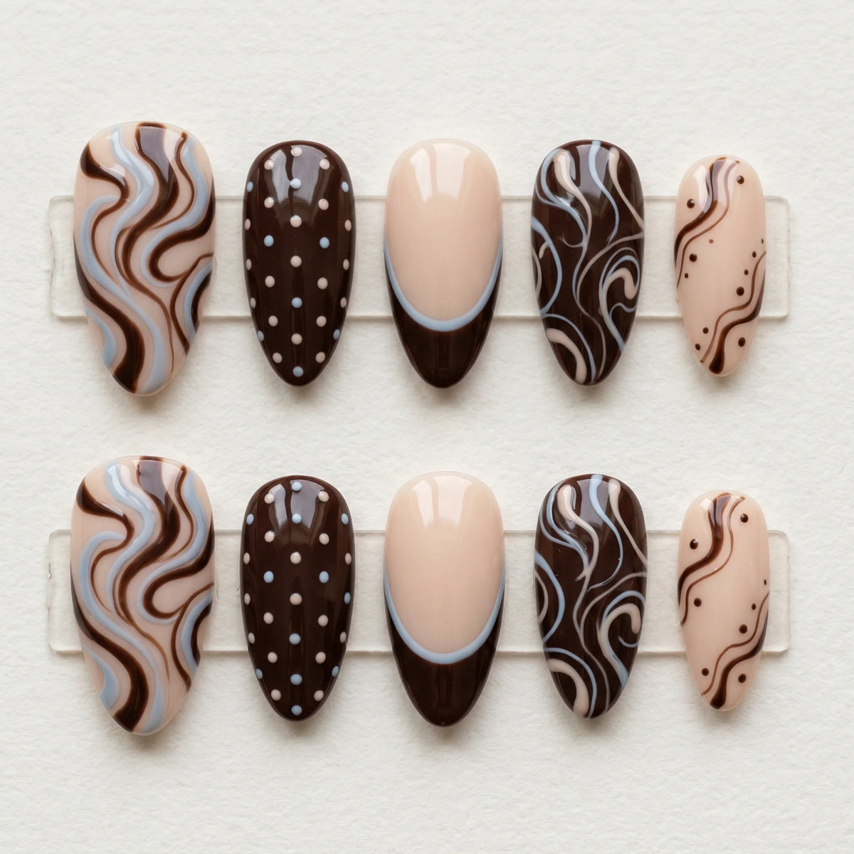 brown hand painted almond medium press on nails swirl polka dot flat lay 01