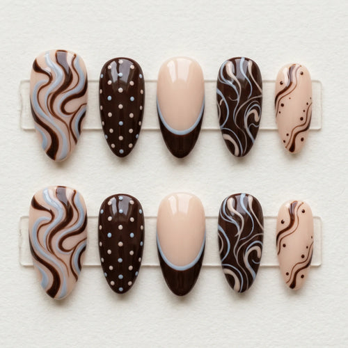 brown hand painted almond medium press on nails swirl polka dot flat lay 01