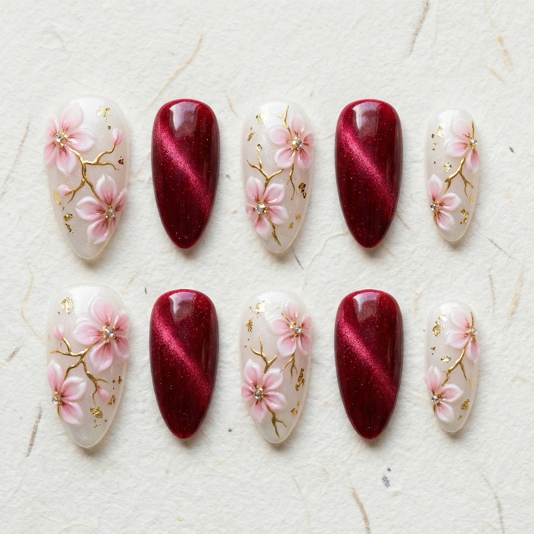 burgundy cat eye hand painted stiletto medium press on nails pink sakura lifestyle 02