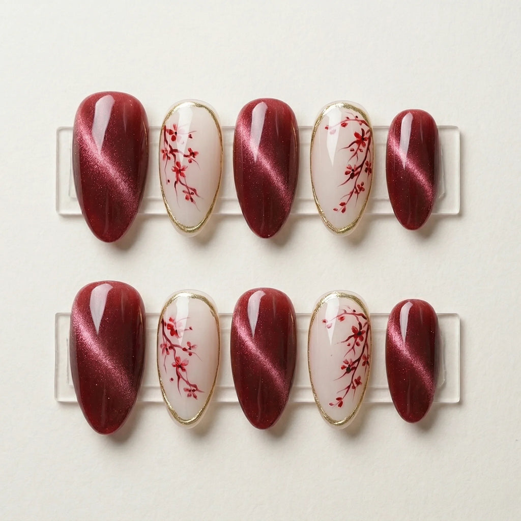 burgundy cat eye hand painted stiletto medium press on nails red cherry blossom flat lay 01
