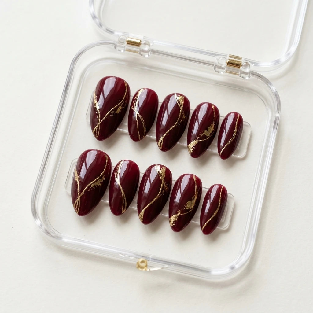 burgundy gold foil almond press on nails swirl detail 03