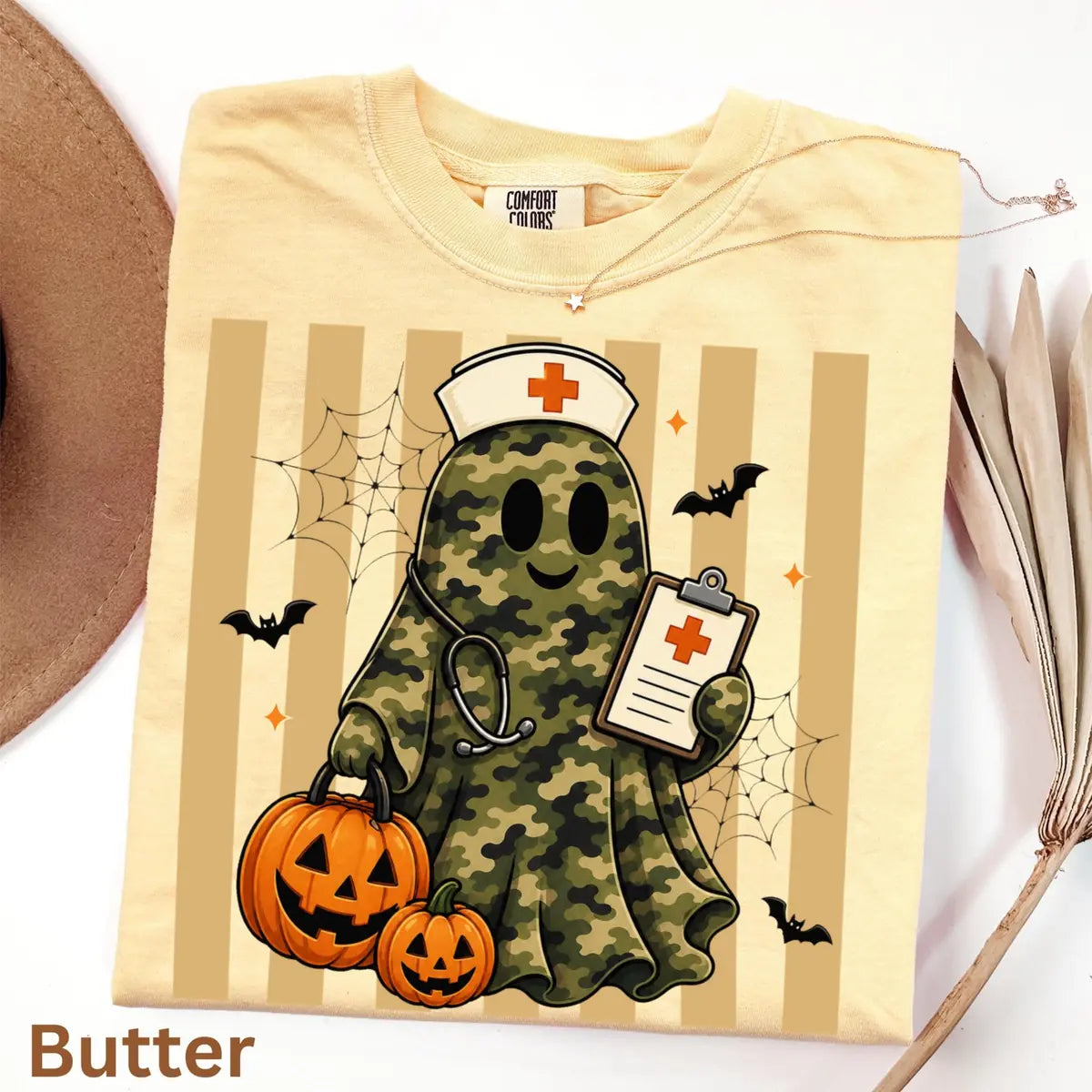 Comfort Colors T-shirt flatlay in Butter color featuring Camo nurse ghost graphic