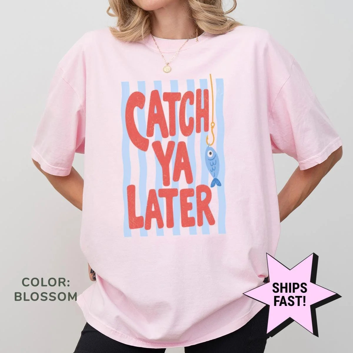 Woman in a Blossom pink Comfort Colors tee, hands on hips, with catch ya later in red over blue stripes