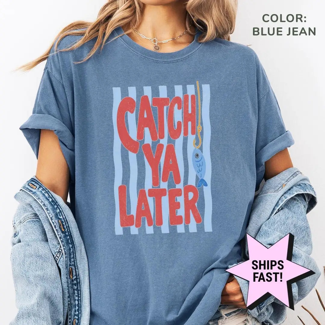 Woman in a Blue Jean Comfort Colors tee and a denim jacket with red catch ya later lettering on a striped panel
