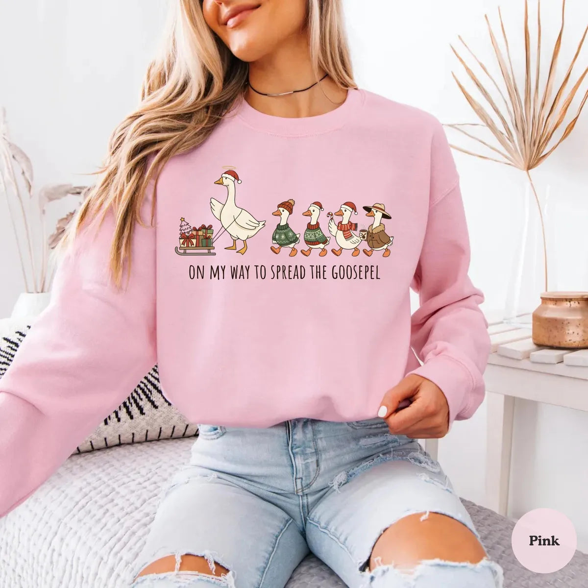 Christian Christmas Crewneck Sweatshirt shown on a model in Pink.