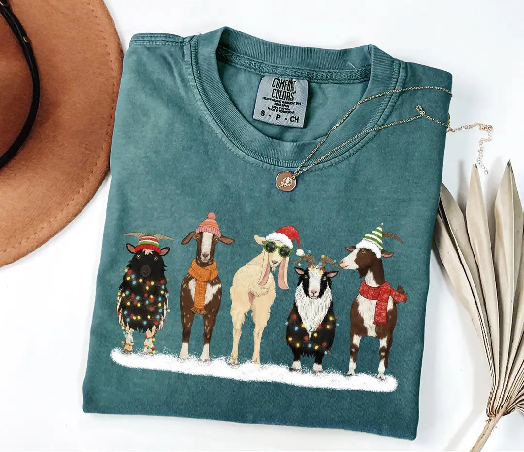 Blue Spruce Comfort Colors T-shirt featuring farm animals dressed in Christmas outfits.