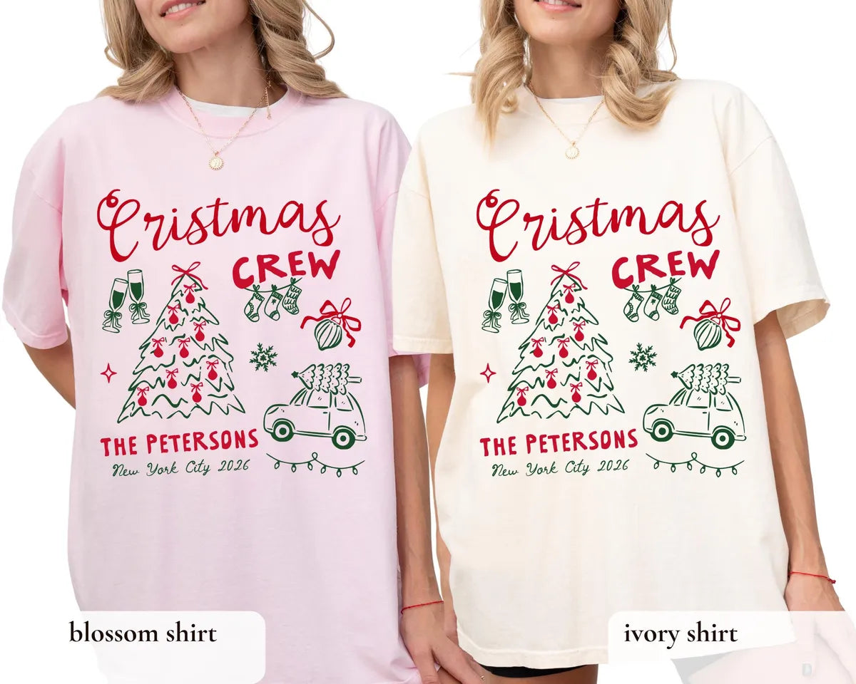 Two women in Blossom pink and Ivory Comfort Colors tees, red crew script, bow tree and a car with a tree on top