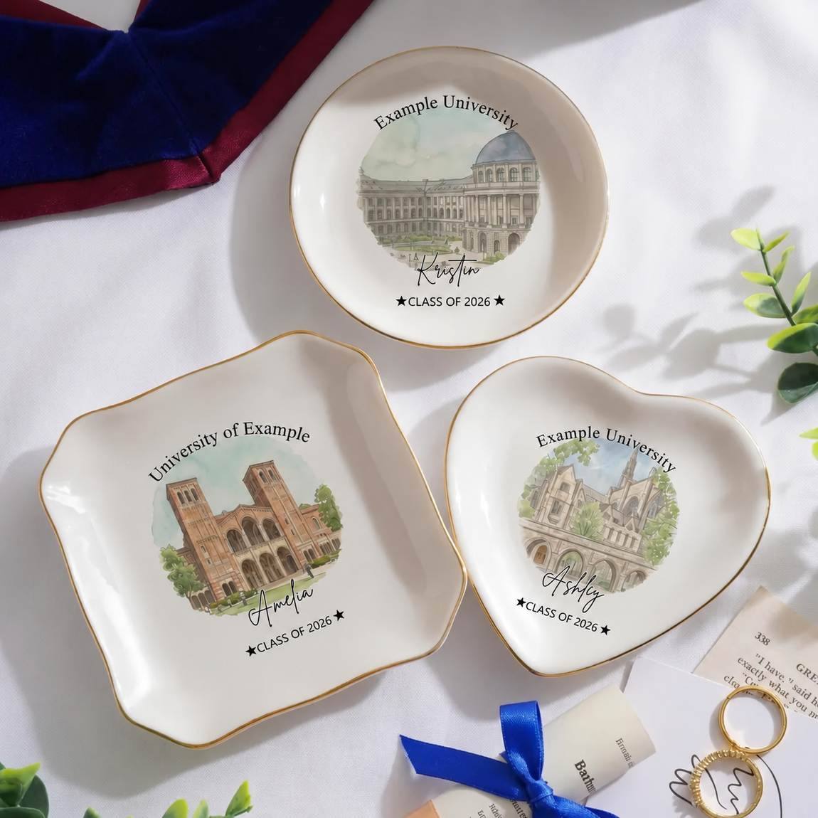 Three different photo-graduation ring dish displayed elegantly on a white table. Each ring dish has different shape.