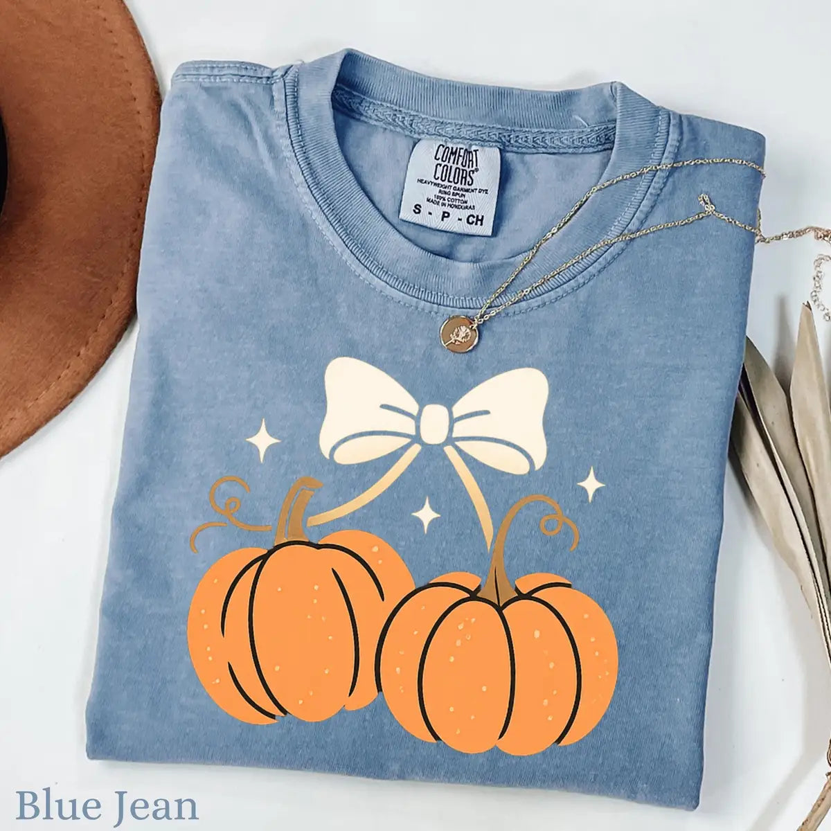 Comfort Colors T-shirt in Pepper color featuring pumpkins with bow graphic