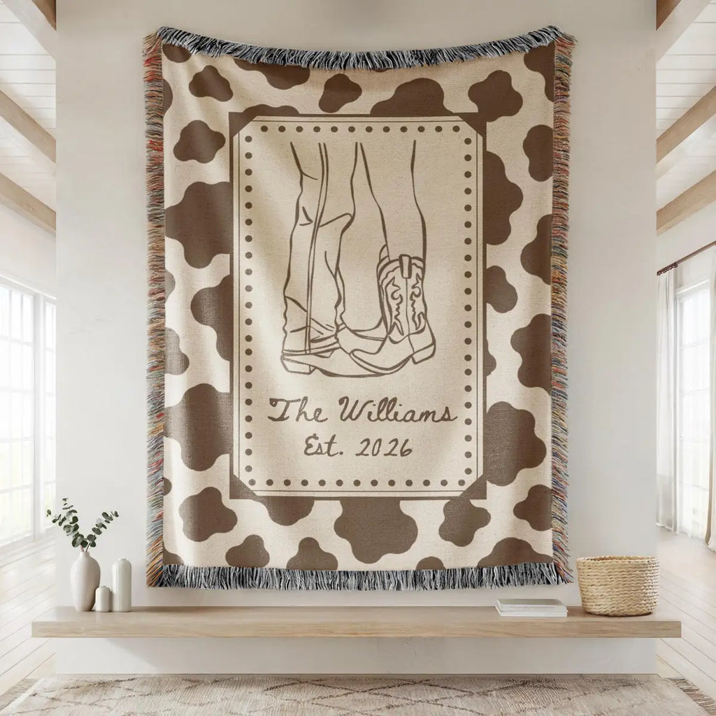 Close-up of the personalized cow print western woven blanket with texture and fringe detail