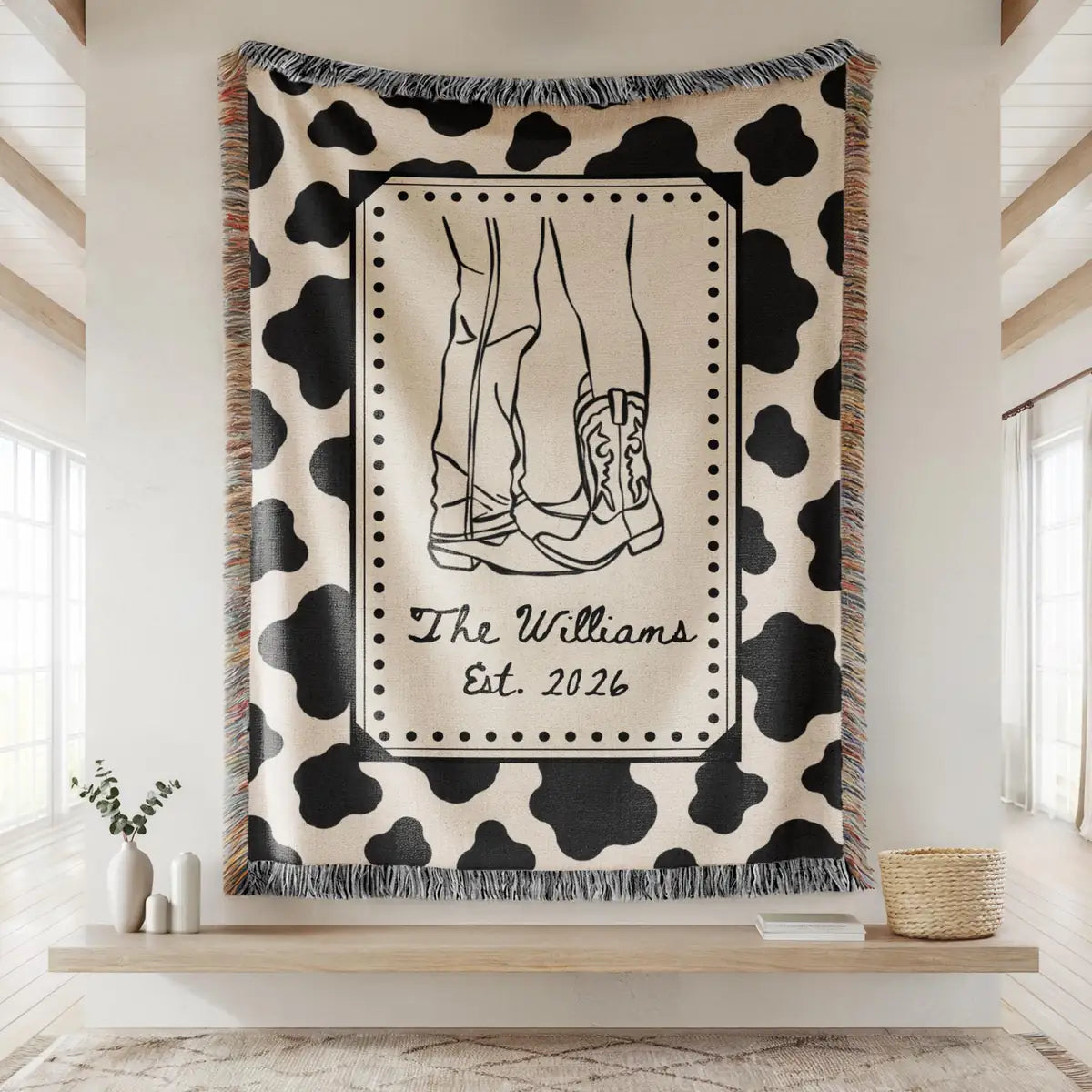 Personalized cow print western woven blanket shown in a styled room setting