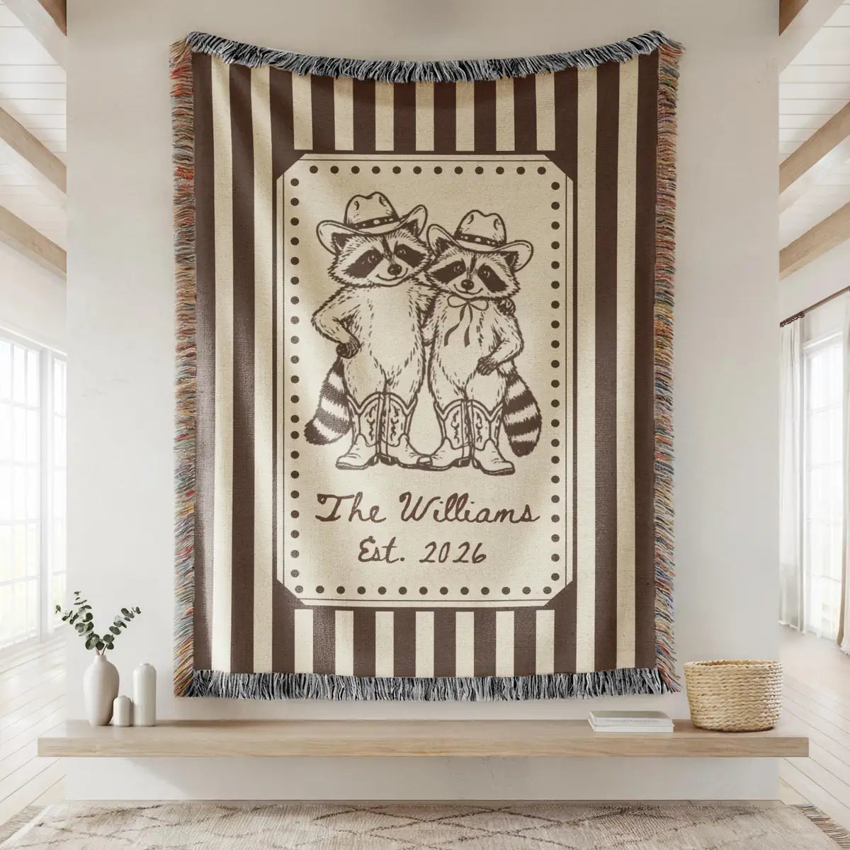 Close-up of the personalized cowboy raccoon striped woven blanket with texture and fringe detail