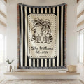 Close-up of the personalized cowboy raccoon striped woven blanket with texture and fringe detail