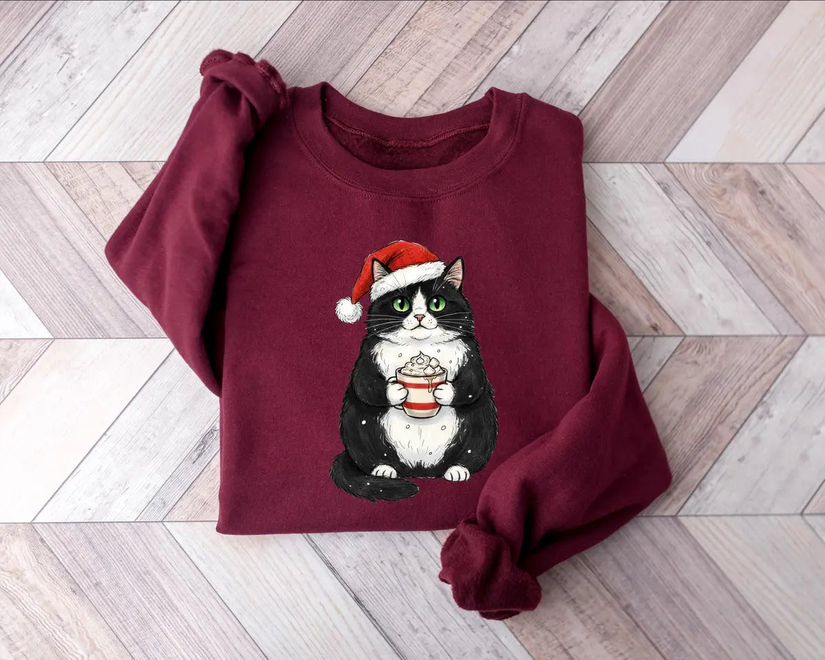 Cute Christmas Black Cat crewneck sweatshirt pictured in Maroon.