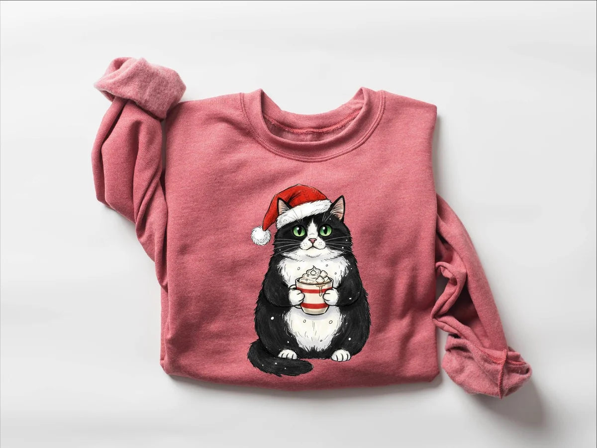 Cute Christmas Black Cat crewneck sweatshirt pictured in Dusty Pink.