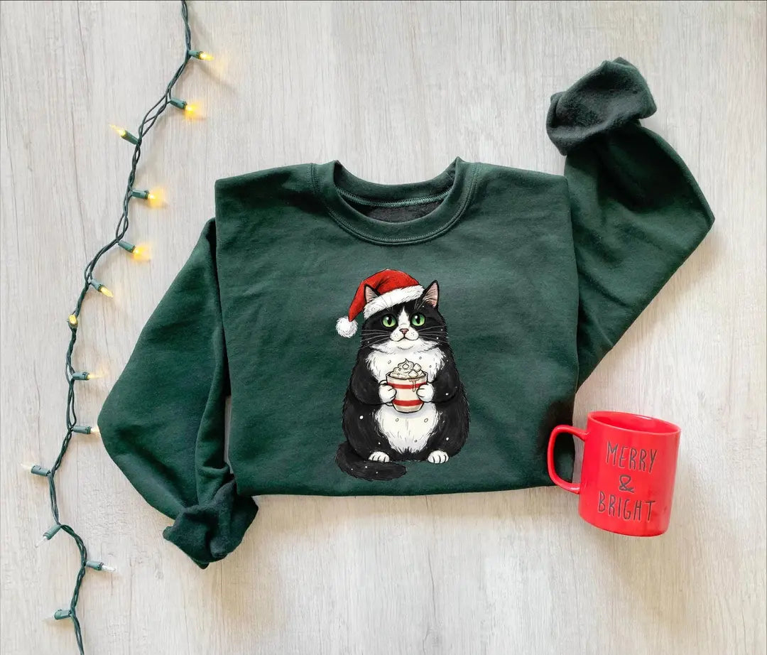 Cute Christmas Black Cat crewneck sweatshirt pictured in Forest Green.